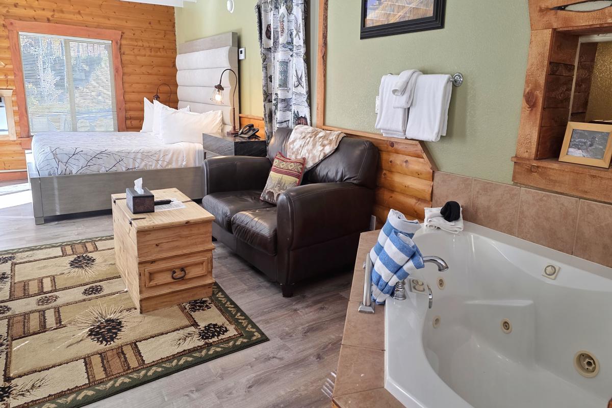 Estes Park condo living room and bed